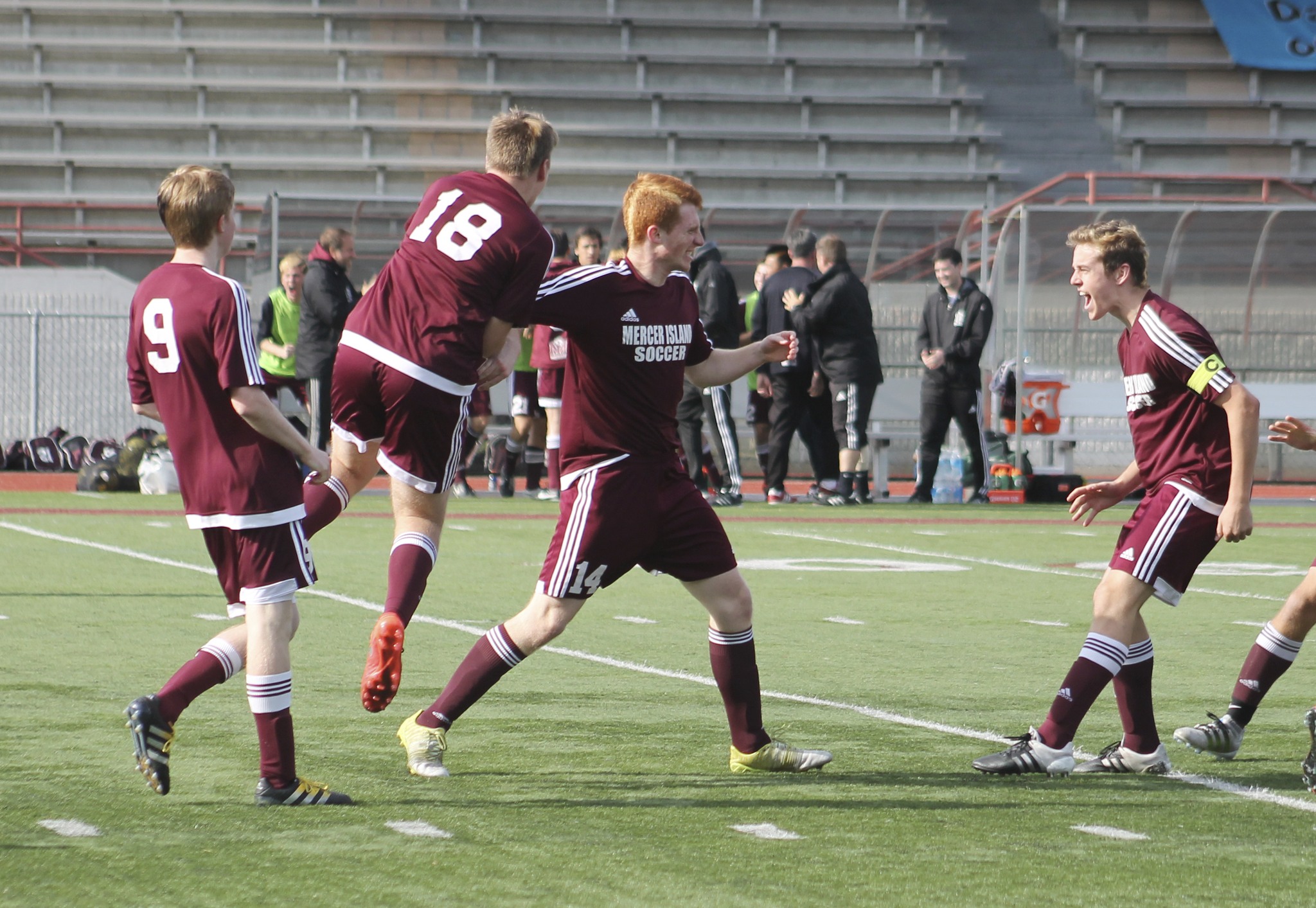 Mercer Island’s Austin Taylor (center) celebrates with teammates after scoring in the 42nd minute of the Islanders’ 3A state semifinal matchup against Edmonds-Woodway Friday at Sparks Stadium. The Islanders beat the Warriors 1-0 to advance to the state championship game (Joe Livarchik/staff photo).