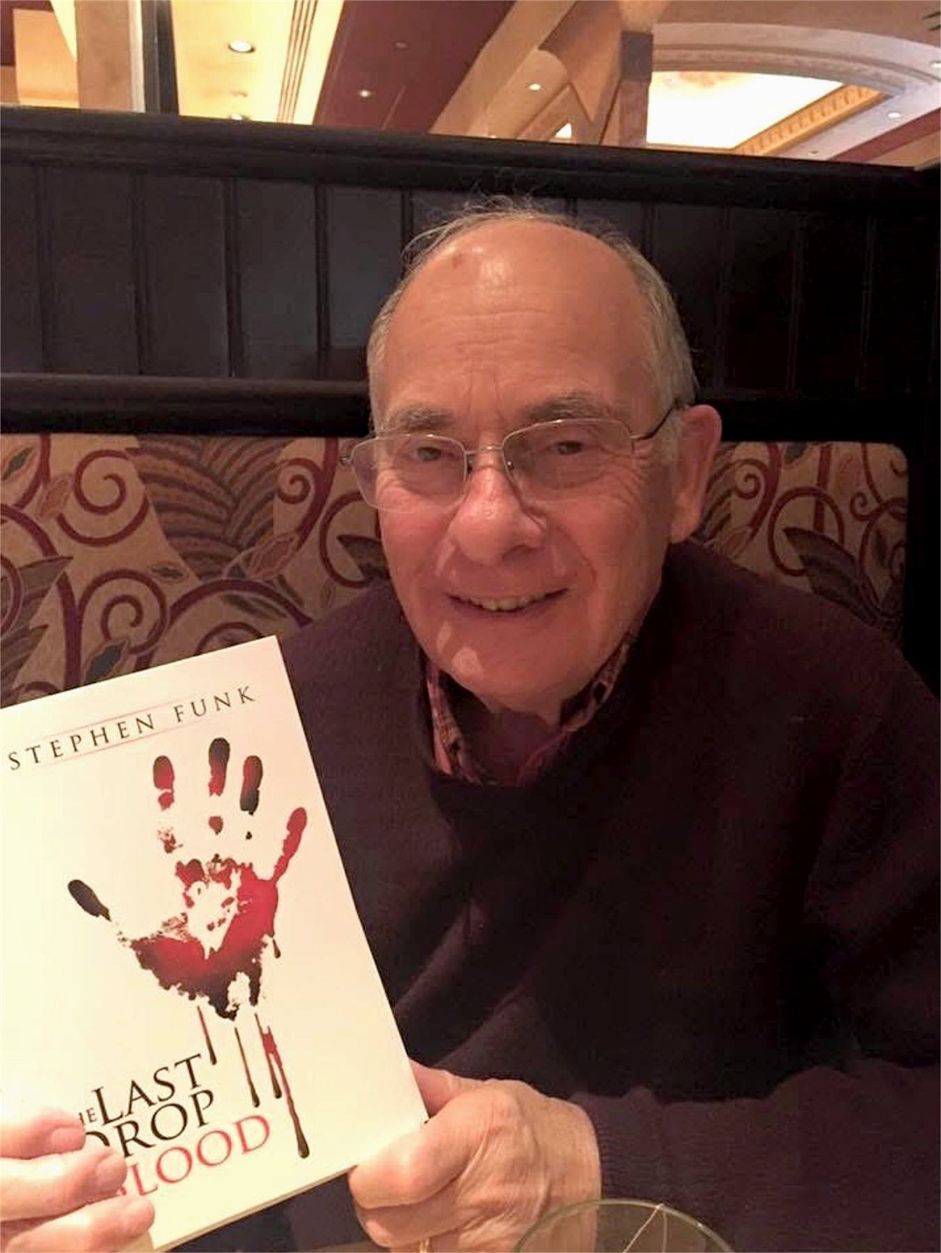 J. Stephen Funk poses with his self-published book