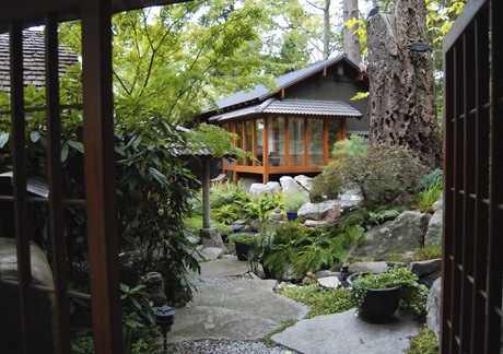 A regal Japanese gate welcomes friends to the home of Islanders Judy Roan and Ron Reeder. The house was built by Zema in 1991. It was the last home that the iconic Northwest architect designed.