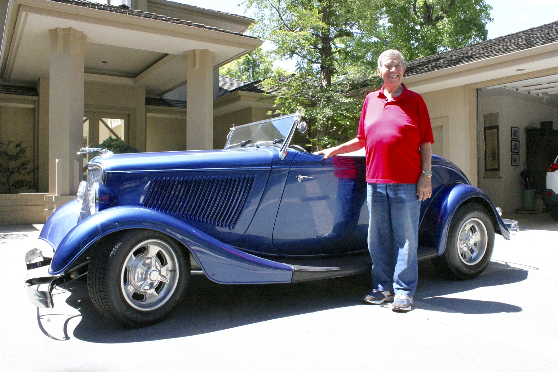 Islander Terry Deeny poses with his car