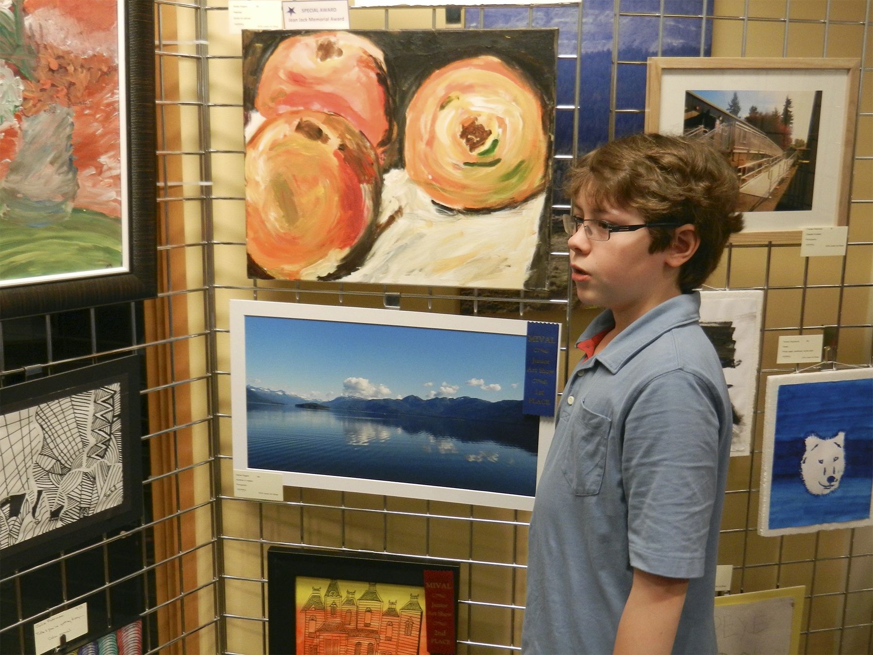 Fifth grader Kieran Rogers poses with his “Summer in Alaska” photo and his Jean Jack Award winning “Peaches