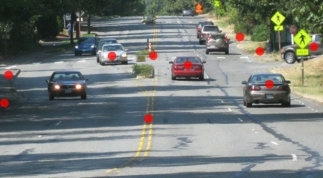 Red dots signify “trouble areas” in an image of the four-lane configuration on Island Crest Way. The photo was one of many on a website created by Islanders who supported a three-lane option for the road. File photo.