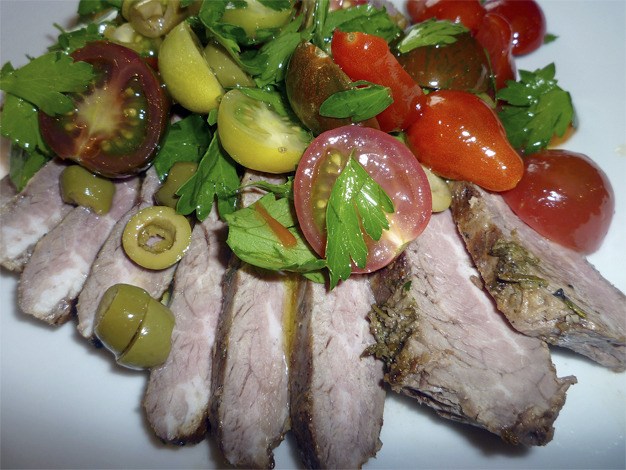 Herb crusted flank steak with cherry tomatoes and olives makes a wonderful and easy Father’s Day supper.