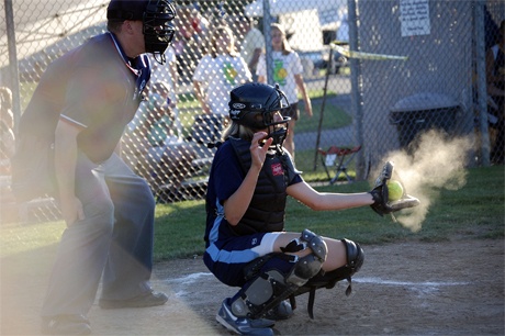 Mercer Island’s Claire McCarthy catches a pitch (above). In California