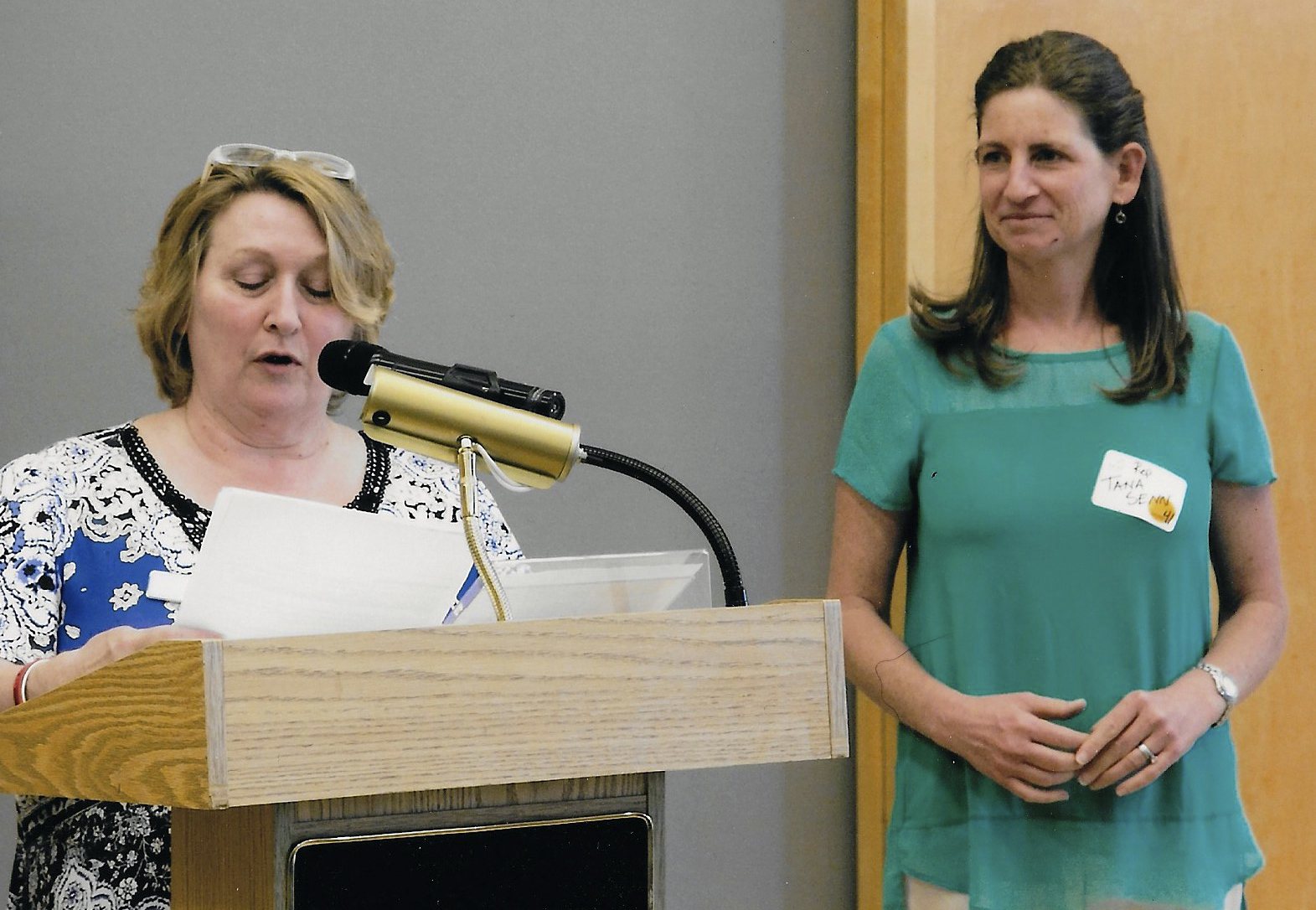 Bellevue resident and former Parent to Parent coordinator Cathy Murahashi (left) presents Rep. Tana Senn with an award. Contributed photo