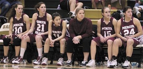 The Mercer Island girls basketball starting lineup watches from the bench during a game at the Nike Tournament of Champions in Phoenix