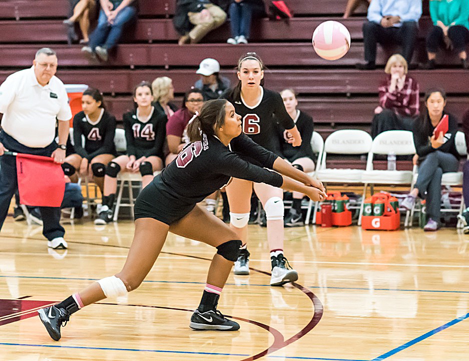 Mercer Island’s Adara Hamilton goes in for the dig against Holy Names Academy on Oct. 7 at Mercer Island High School. Photo courtesy of John Fisk.