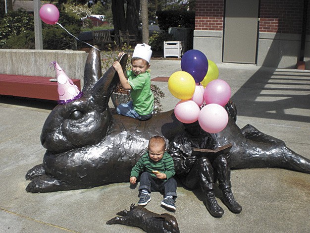 Winston and Kennedy Mazure celebrated the 20th birthday of the rabbit statue at the Mercer Island library last week. Programs like this have long been staples of the King County Library System.