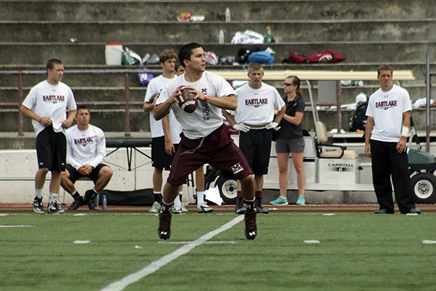Mercer Island quarterback Alfonso Gonzalez looks to pass against Eastlake at the ‘Rumble on the Rock.’