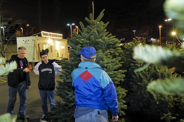 The Lion’s annual Christmas tree sale begins the day after Thanksgiving each year in the Farmers Insurance parking lot. The trailer