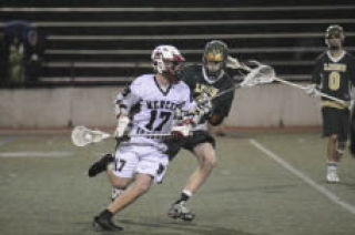 Islander Steven Taylor brings the ball up field.