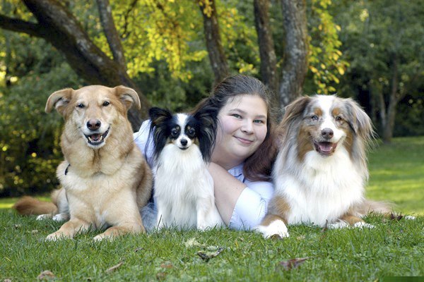 Vet tech Monique Feyrecilde poses with her pets