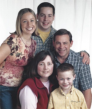 The Mjelde family poses for a photo in 2002