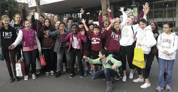Islander Middle School students show their We Day spirit in front of Key Arena on Wednesday
