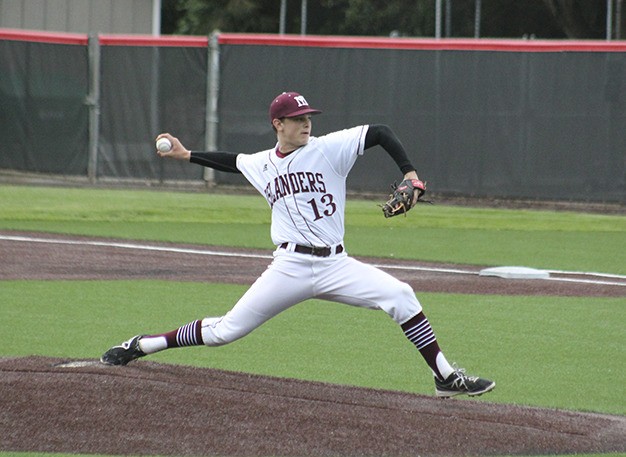 Mercer Island's Peter Lopes delivers a pitch against Bellevue Tuesday