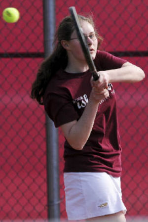 Islander Michelle Zemplenyi returns a volley against Holy Names on Friday as she defeats her opponent 8-0. The Islanders won the meet 8-3 to remain undefeated