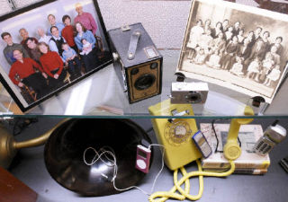 A display for Older Americans Month at the Mercer Island library shows changes in technology over the years.