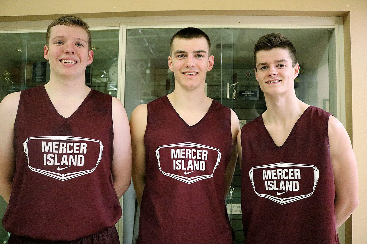 From left, Mercer Island boys basketball players Jacob Evans, Griffin Emanuels and Shain Scott. Joe Livarchik/staff photo.