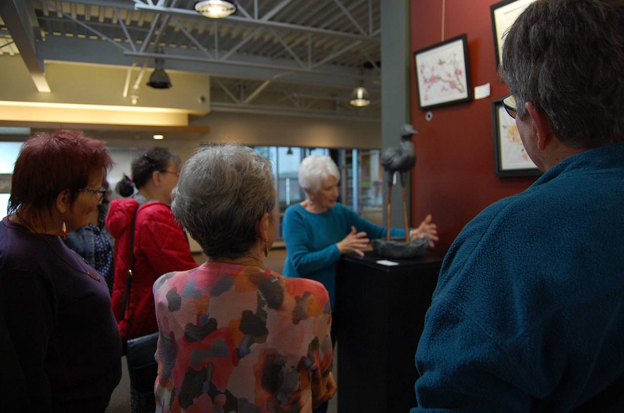 A crowd admires MIVAL artist Sharon Jamieson’s work at the Community and Event Center on Nov. 3. Katie Metzger/staff photo