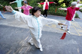 Juyu Zhao practices Tai Chi with fellow Elsworth House residents. A group of 10 to 15 residents meets at 7 p.m. every evening to practice the ancient Chinese art.