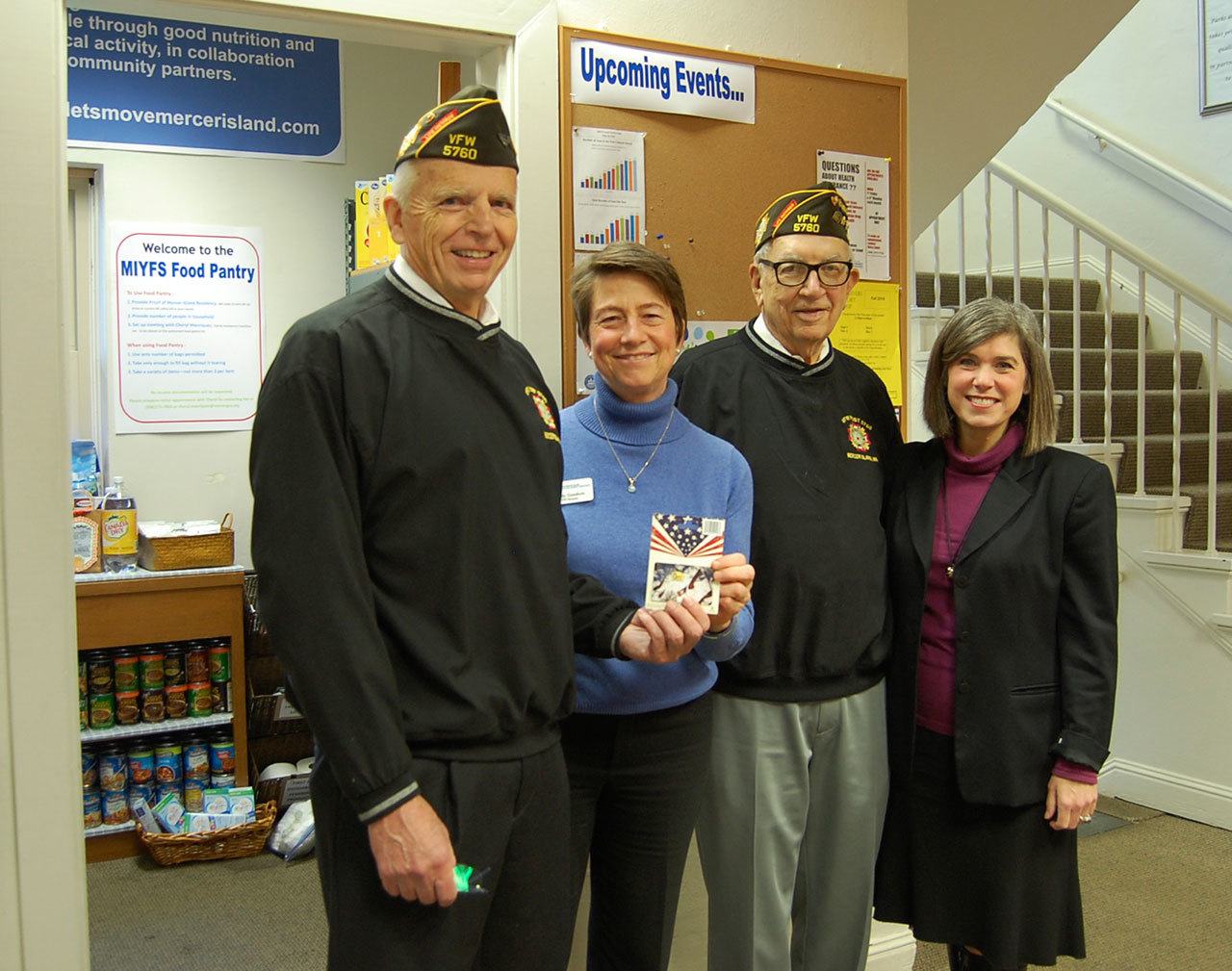 Bob Harper and Dean Quigley of the VFW pose with Cindy Goodwin and Sari Weiss of the city of Mercer Island’s Youth and Family Services (YFS) Department.