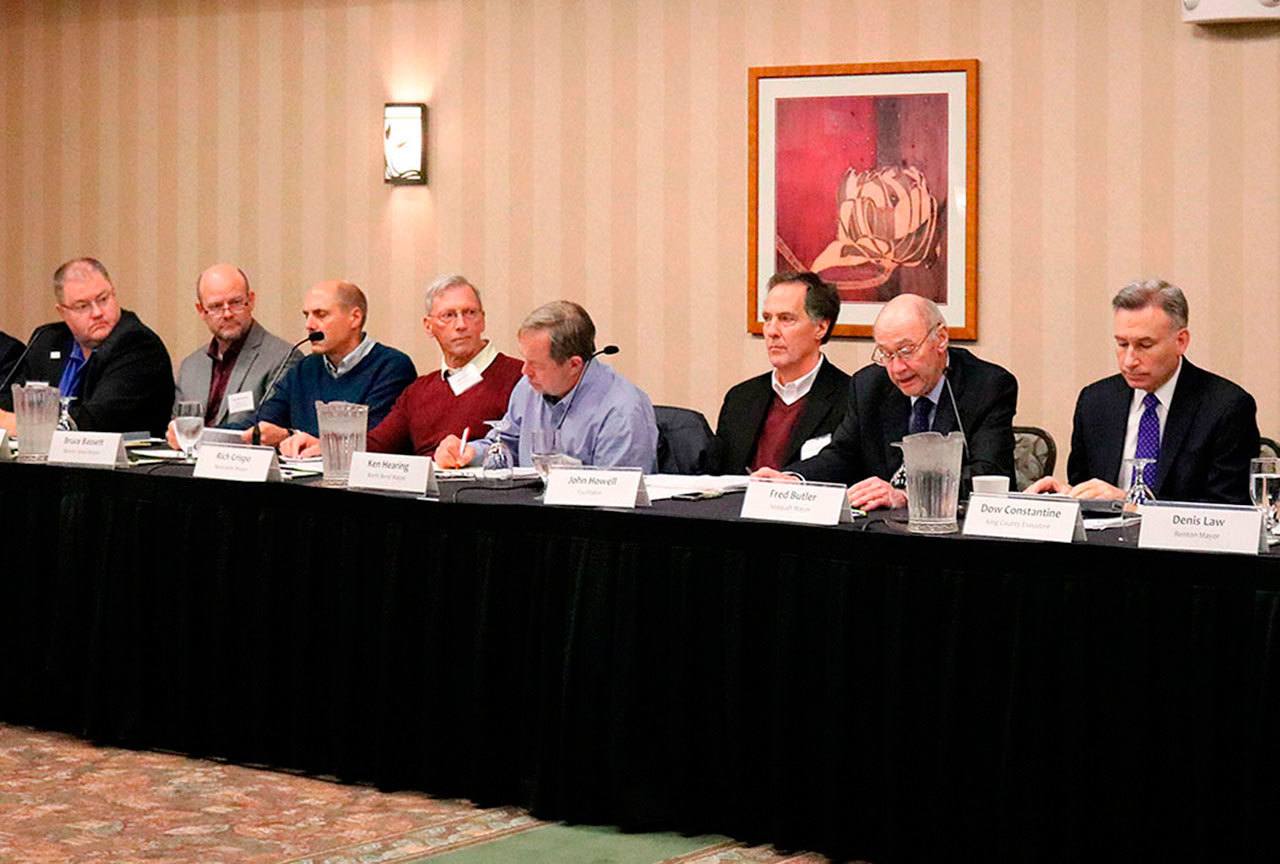 Mercer Island Mayor Bruce Bassett (third from left) discusses pass-through traffic and other transportation issues with regional leaders including King County Executive Dow Constantine (far right) and Issaquah Mayor Fred Butler (second from right). Nicole Jennings/staff photo