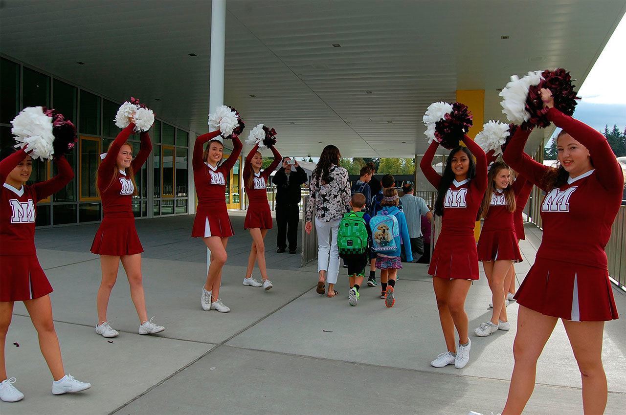 Mercer Island High School cheerleaders welcomed students to Northwood Elementary, the first new school building constructed on the Island since 1963, on Aug. 31. Katie Metzger/staff photo
