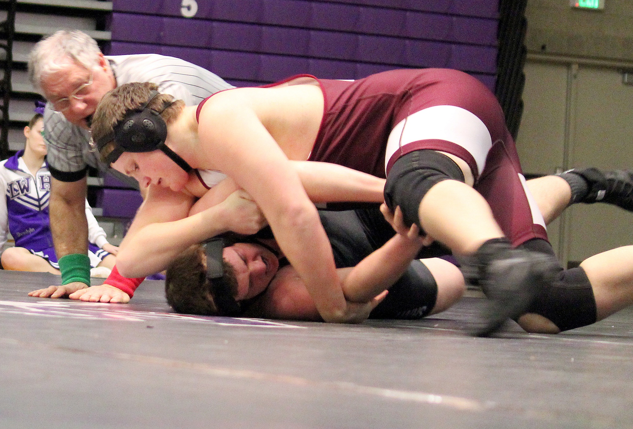 The Mercer Island Islanders wrestling team captured a 39-31 victory against the Lake Washington Kangaroos on Jan. 12. Mercer Island grapplers earning victories via pins included Piljin Kwak (145), Finn Childress (152), Colin Farrell (170), Connor Hill (195) and Teague Frazier (220). Islanders’ wrestlers winning by decision included Eli Pruchno, Donnie Howard (182) and Jordan Tillinger (113). Frazier (pictured) pinned Lake Washington’s Andy Davis in the first round of the 220-pound matchup.                                Photo courtesy of Jamie Childress