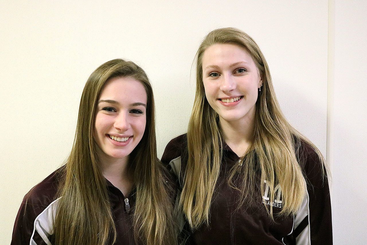 From left, Mercer Island gymnastics captains Madeline Gile and Emily Greaves (Joe Livarchik/staff photo).