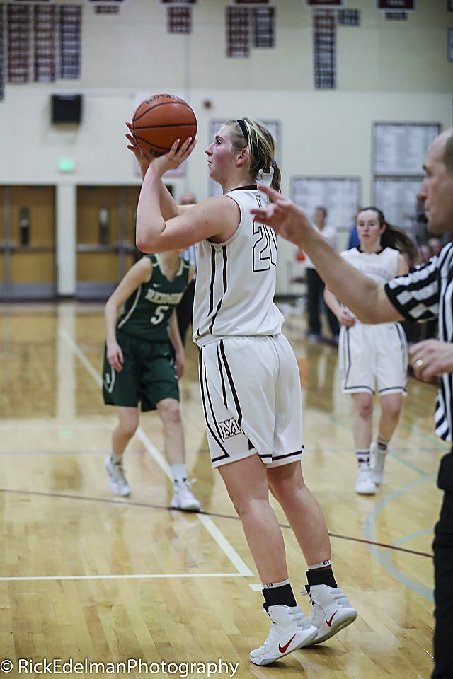 Photo courtesy of Rick Edelman/Rick Edelman Photography                                Mercer Island senior post player Anna Luce knocks down a short jumper against the Redmond Mustangs on Jan. 20. Luce, who has been on the Islanders varsity team since her freshman season, will play college basketball at Dartmouth College.
