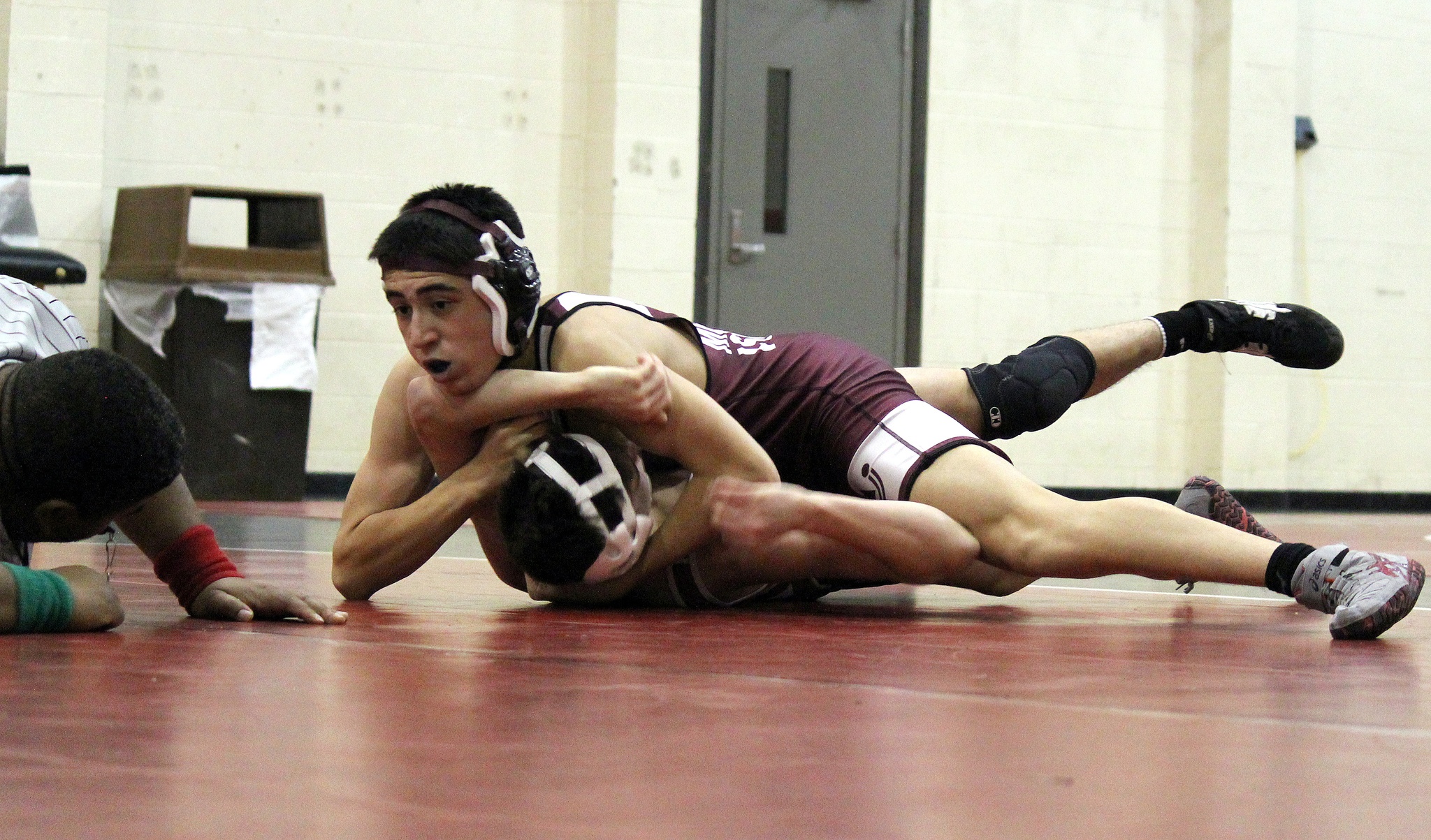 Photo courtesy of Jamie Childress                                The Mercer Island Islanders wrestling team captured two victories in a Class 3A KingCo double dual match on Jan 26. The Islanders defeated the Bellevue Wolverines 65-15 and cruised to a 52-16 win against the Juanita Rebels. Vinny Ricci (pictured) pins Juanita wrestler Nathan Ferrell on Jan. 26. In the matchup against the Wolverines, Mercer Island grapplers capturing wins via pins were Sean Cote (126), Vinny Ricci (138), Melissa Tran (145), Jonah Andrews (160), Colin Farrell (170) and Connor Hill (195). In the showdown against Juanita, Islanders’ wrestlers nabbing wins courtesy of pins consisted of Ricci (138), Finn Childress (152) and Teague Frazier (220).