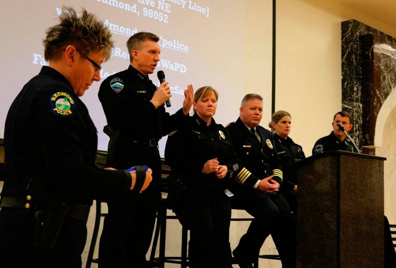 Mercer Island Police Department Chief Ed Holmes, standing, speaks during the Eastside Muslim Safety Forum. Also pictured, from left, are chiefs Kristi Wilson (Redmond), Cherie Harris (Kirkland), Steven Mylett (Bellevue), Michelle Bennett (Sammamish) and Scott Behrbaum (Issaquah). Andy Nystrom/Redmond Reporter