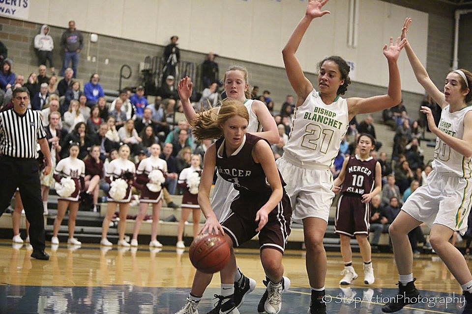Photo courtesy of Don Borin/Stop Action Photography                                Mercer Island junior guard Jessie Stenberg controls the ball while being guarded by Bishop Blanchet star player Jadyn Bush. Bishop Blanchet defeated Mercer Island 48-47 in a Class 3A regional playoff game on Feb. 24 at Bothell High School.