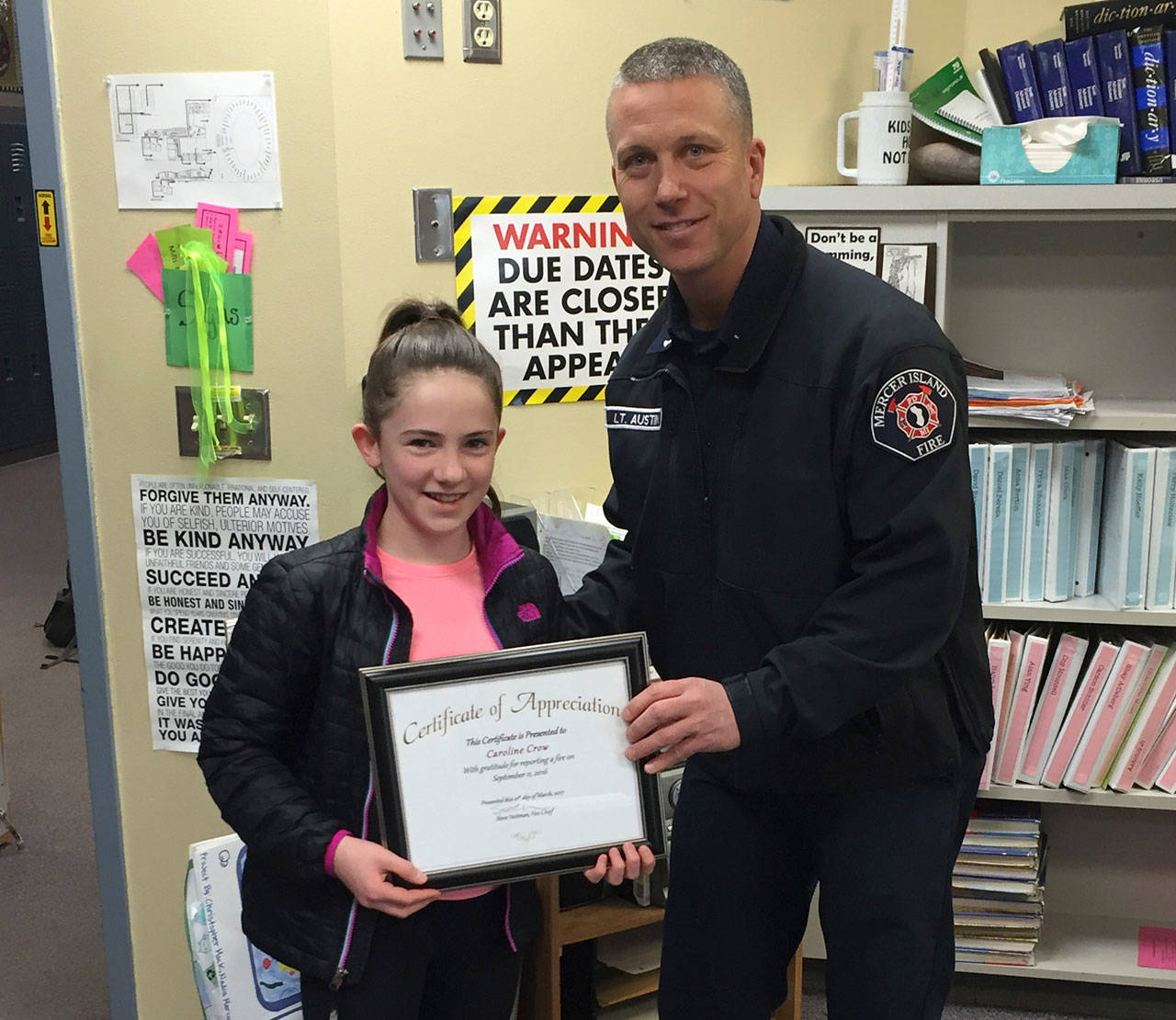 Islander Middle School student Caroline Crow receives her award from MIFD Lt. Ray Austin. Photo courtesy of Ray Austin