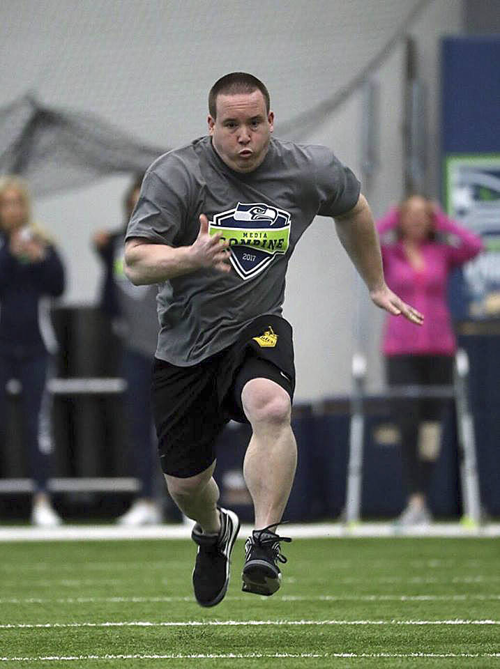 Photo courtesy of Corky Trewin/Seahawks.com                                Sportswriter Shaun Scott sprints in the 40-yard dash at the second annual Seattle Seahawks media combine on Feb. 22 at the Virginia Mason Athletic Center in Renton.