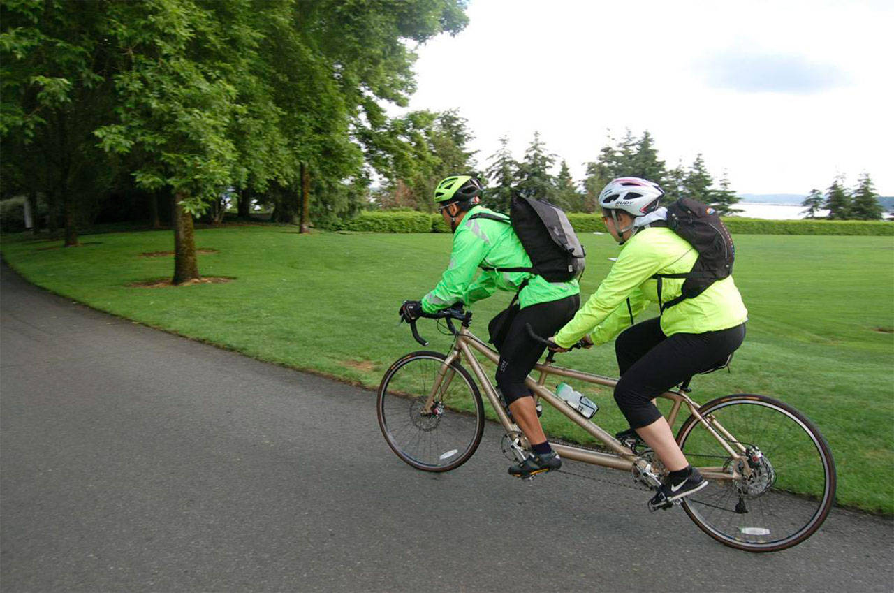 Cyclists ride a tandem bike on Mercer Island’s Lid. File photo