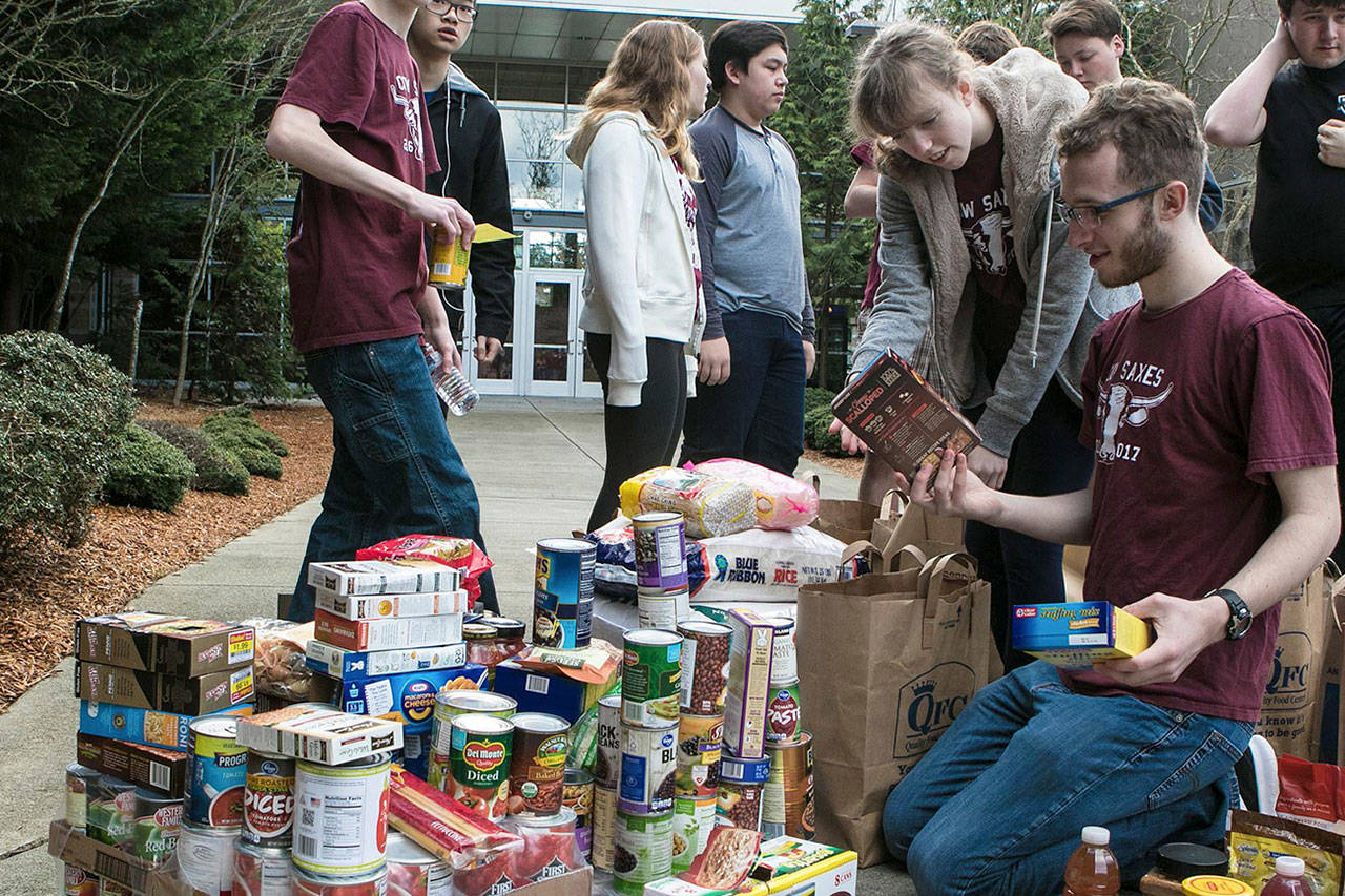 Mercer Island High School Band students collected more than six tons, or 12,300 pounds, of food and donations on April 2. Photos courtesy of David Cummings