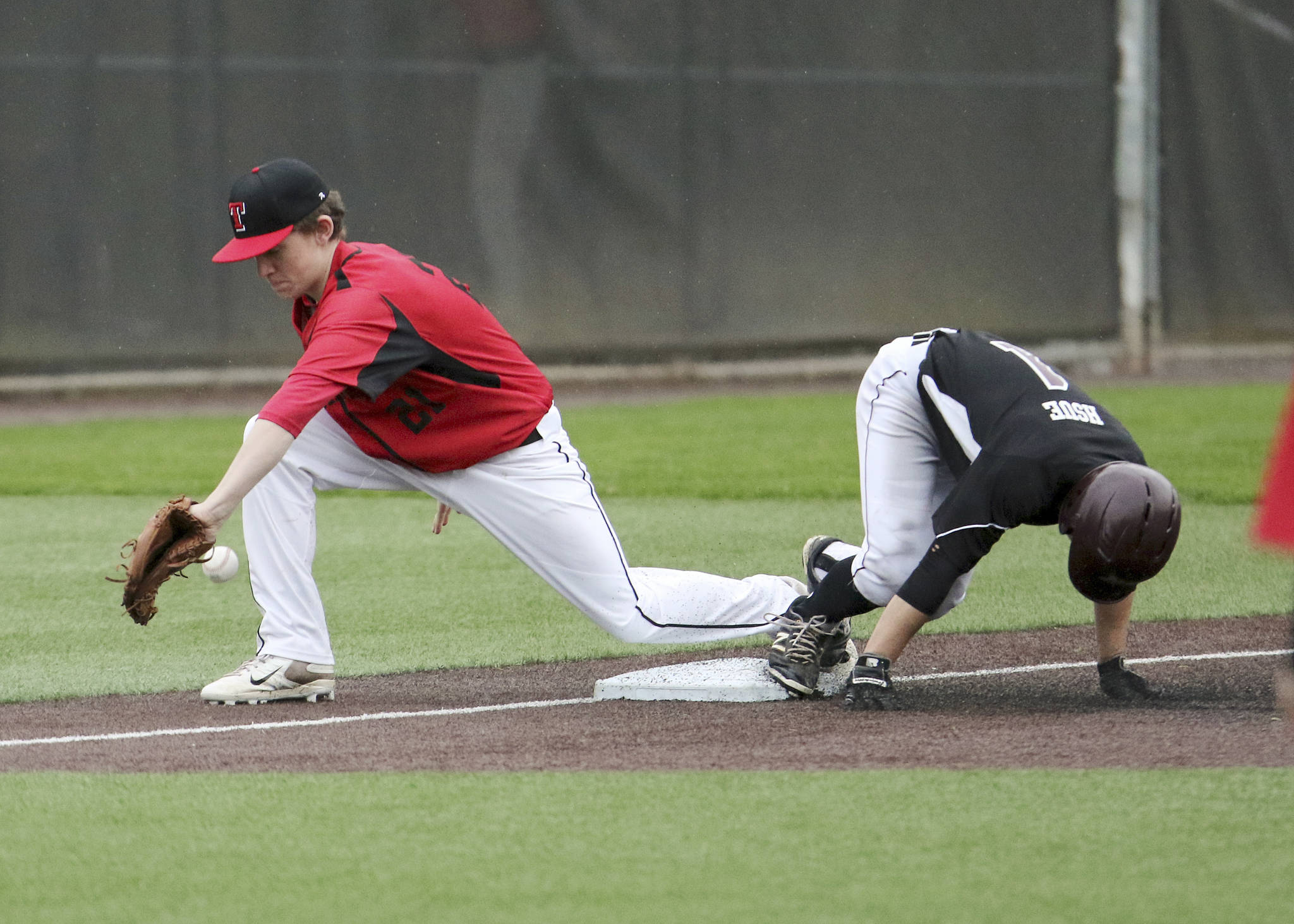 Photo courtesy of Jim Nicholson                                Mercer Island leadoff hitter Nolan Hsue slides safely into third base against the Sammamish Totems on April 5 at Bannerwood Park in Bellevue.