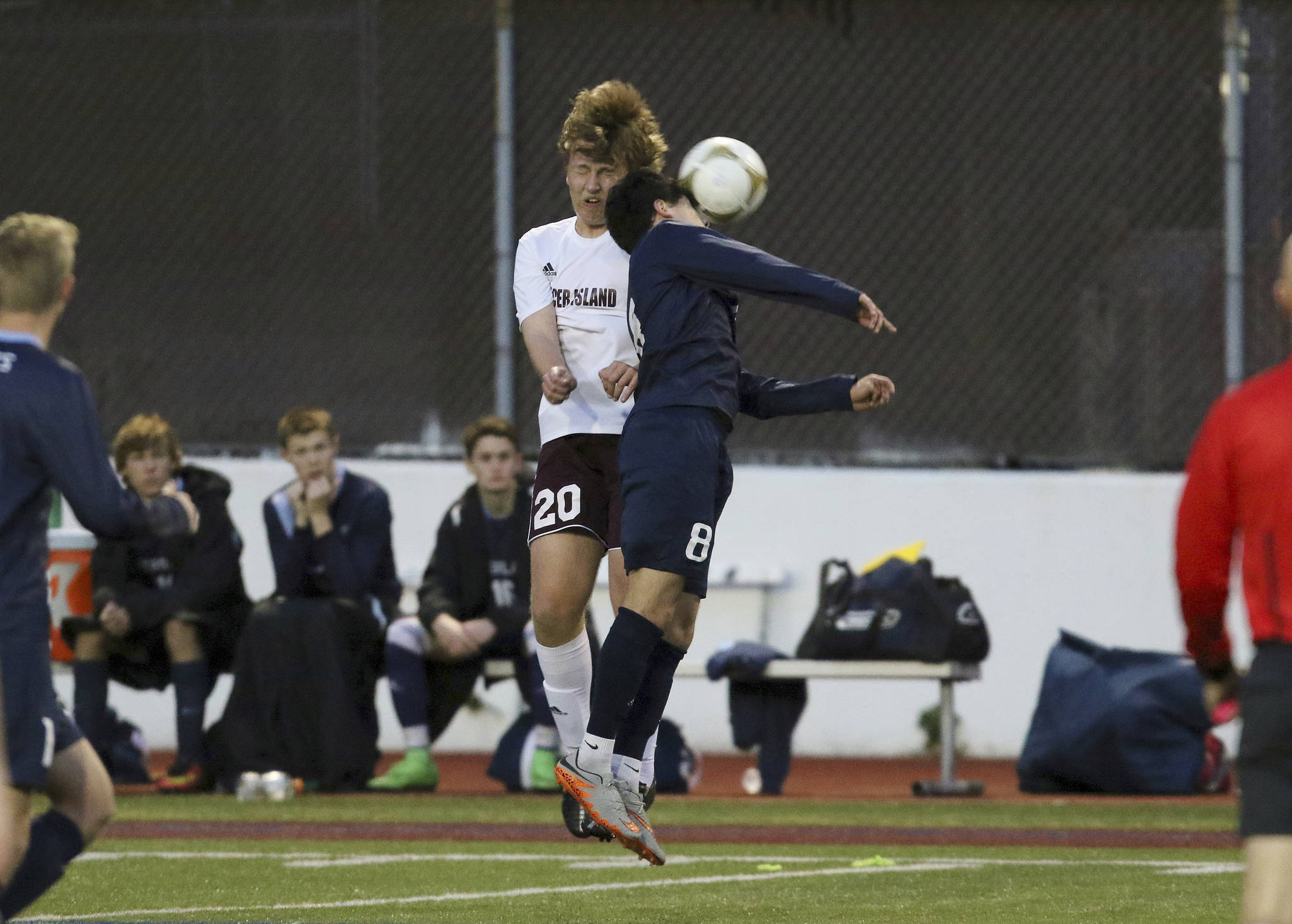 Photo courtesy of Jim Nicholson                                Mercer Island defender Ian Onrust, left, and Interlake midfielder Oseil Monfeda, right, soar into the air in an attempt to gain possession of the ball in a battle between rivals on April 12. Mercer Island defeated Interlake 4-3.