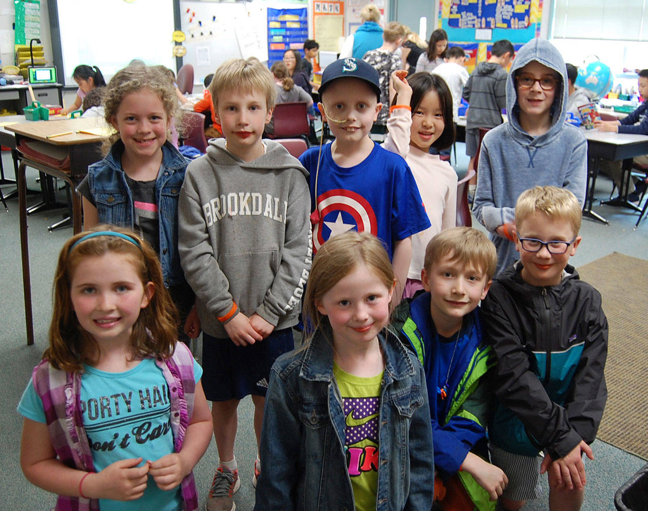 The Lakeridge K-Kids are supporting second grader Ewan Lill (center) by selling bracelets to raise money for cancer research. Katie Metzger/staff photo