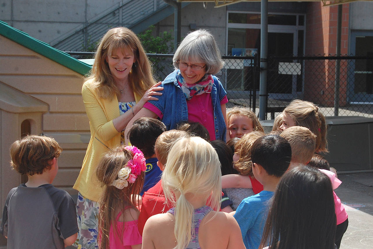 Miss Kathy gets a hug from a student at the Creative Learning Center after being surprised with MIPA’s Exceptional Educator award. Katie Metzger/staff photo