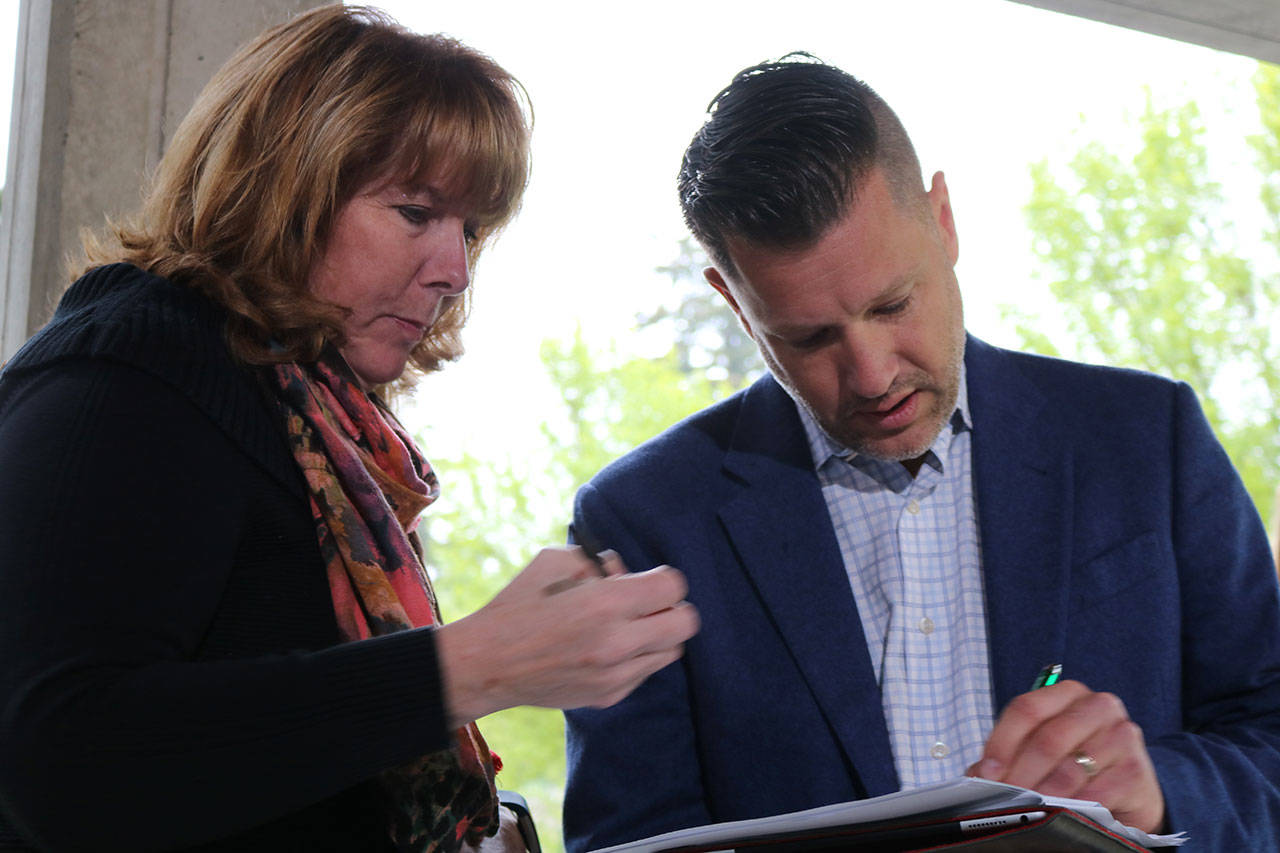 Joshua Freed, right, is the chair of Citizens for a Safe King County. The group has launched a campaign to gather signatures to place an initiative on the November ballot which would prohibit government-funded injection sites in the county. Aaron Kunkler/Redmond Reporter