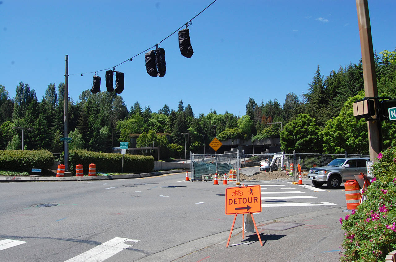 A driver navigates the intersection at 76th Avenue Southeast and North Mercer Way, which is under construction as part of Sound Transit’s temporary traffic improvements, meant to mitigate impacts once the Interstate 90 center lanes close on June 3. Katie Metzger/staff photo