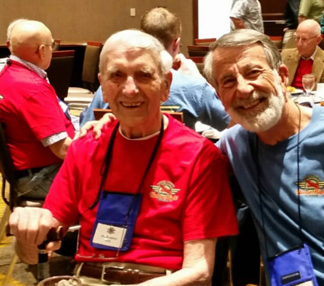 John Kneepkens and his son-in-law, Jim, smile at the farewell dinner of their Honor Flight trip, after visiting war memorials. Photo courtesy of John Kneepkens