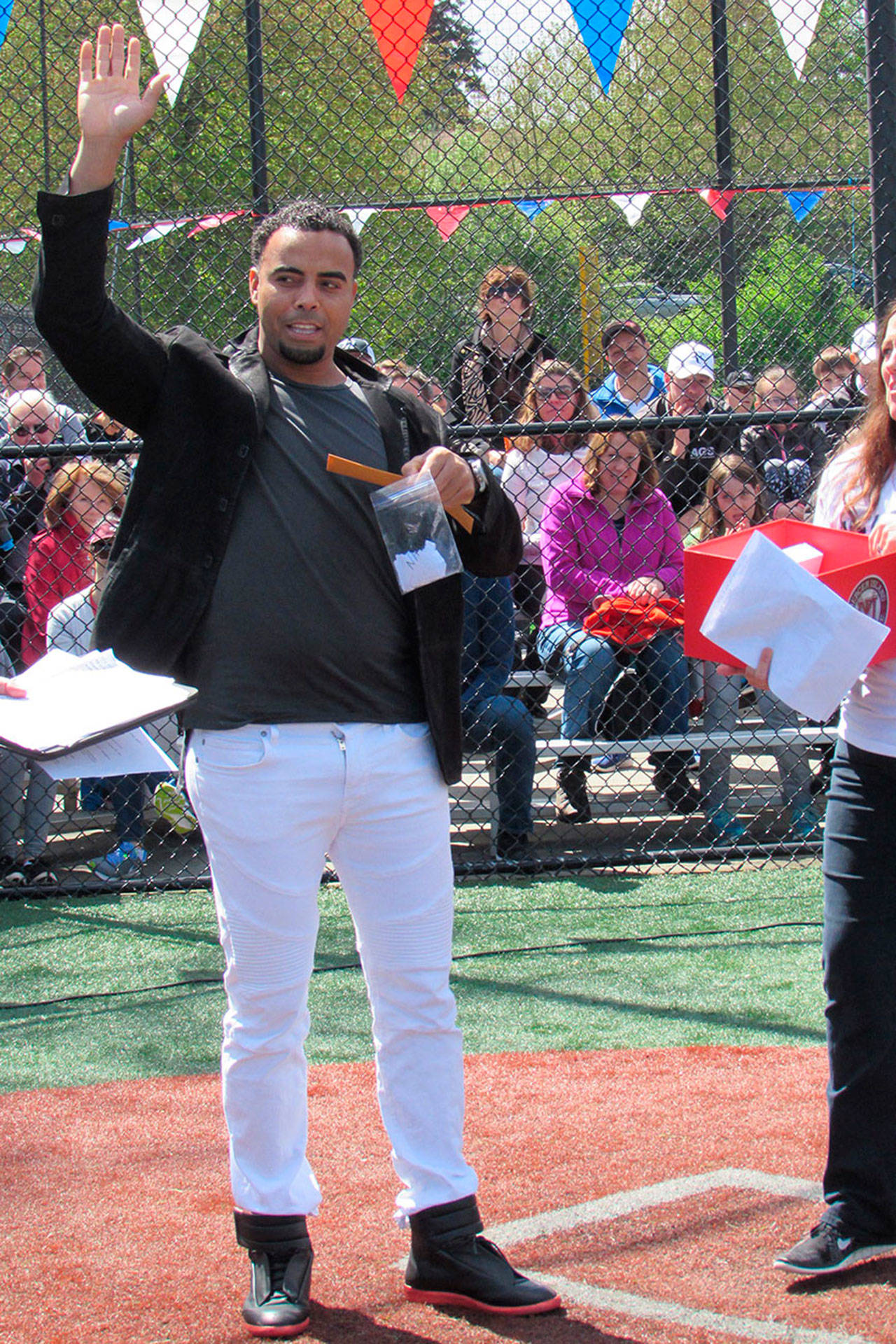 Seattle Mariners baseball player Nelson Cruz greets the crowd at the annual Mercer Island Little League opening day ceremony on May 6 at the South Mercer Playfields. Photo courtesy of Kym Otte