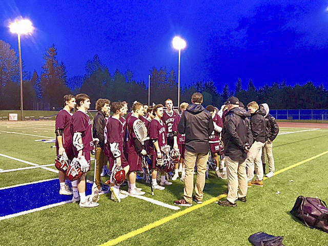 Photo courtesy of Don Howard                                The Mercer Island Islanders boys lacrosse team coaching staff speaks with their players following their 8-5 victory against the Bothell Cougars on May 2 at Bothell High School.