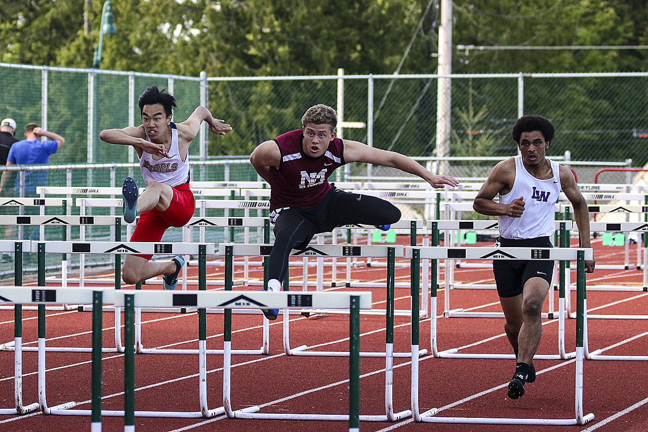 Photo courtesy of Rick Edelman/Rick Edelman Photography                                Mercer Island sophomore hurdler Jack Clayville, center, competed in the 110-meter hurdles at the Class 3A KingCo Championships on May 10 at Skyline High School in Sammamish. Clayville clocked a personal best time of 17.28 in the race. Mercer Island girls athletes competing in the KingCo 3A meet consisted of Maya Virdell (200, 400), Margaret Baker (400), Gretchen Blohm (400), Ella Hensey (400, long jump), Elizabeth Bailey (400), Chloe Michaels (1600), Mary Rose Vu (1600), Kendra Watson (100 hurdles, 300 hurdles), Peyton Bohlinger (100 hurdles, 300 hurdles), Katherine McCormick (300 hurdles), Leah Wootton (discus), Rose Weiker (pole vault), Elizabeth Bailey (pole vault), Aleksandra Kogalovski (pole vault) and Giulia Quarta Cas (long jump). Mercer Island boys competitors included Christopher Yee (200), Euan Dumont (800), Spencer Kingston (800), Jaelin Tate (400, long jump), Randall Schulz (800), Christian Avilez (800), Mitchell Kirby (110 hurdles, 300 hurdles), Charles Fischer (110 hurdles, 300 hurdles), Carl Carlens (300 hurdles), Andy Bliss (shot-put) and Teague Frazier (shot-put).