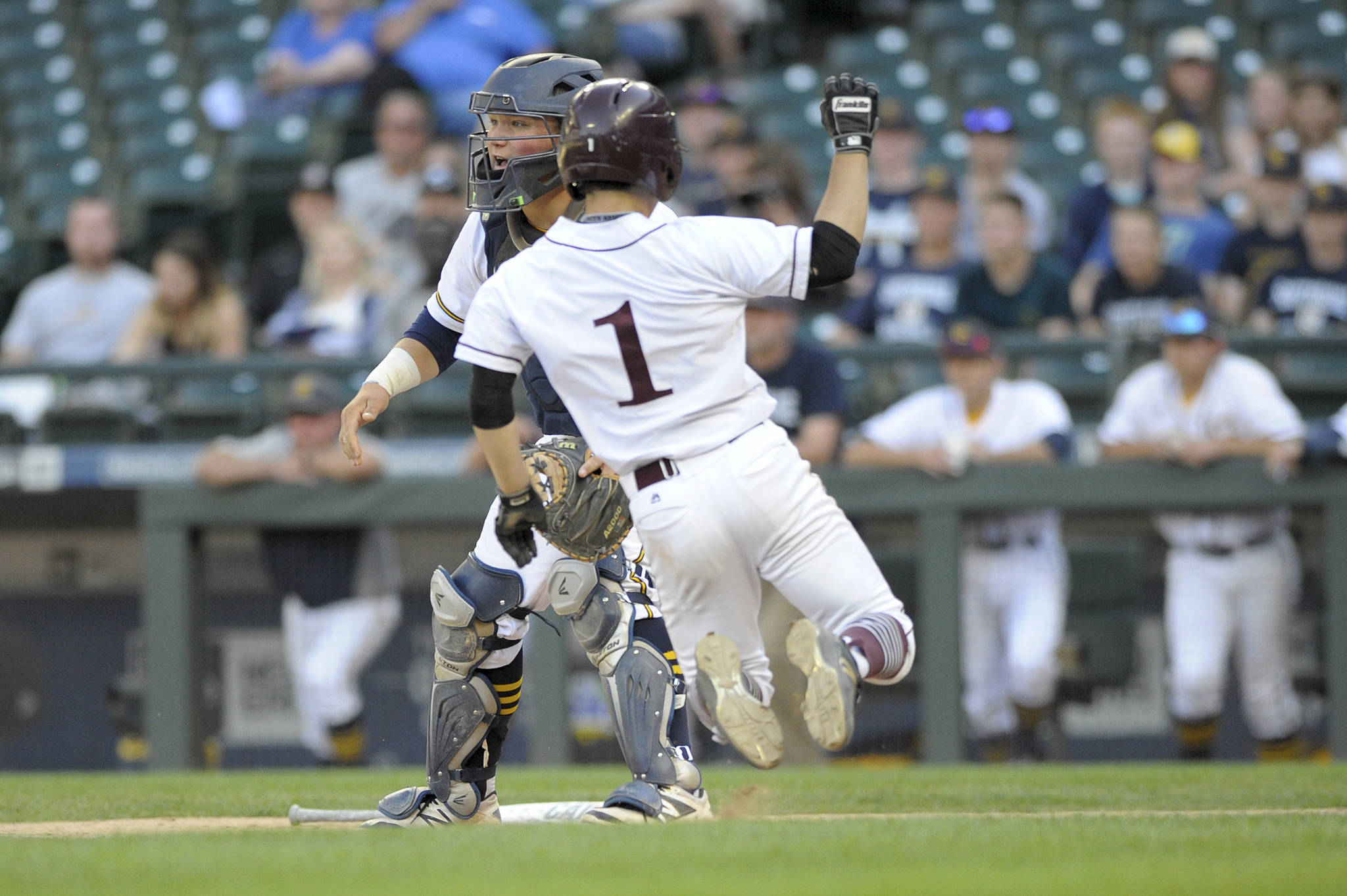 Photo courtesy of Patrick Krohn                                Mercer Island senior Noah Hsue slides into home-plate in the Class 3A state semifinals against the Southridge Suns on May 26 at Safeco Field. Southridge defeated Mercer Island 5-4.