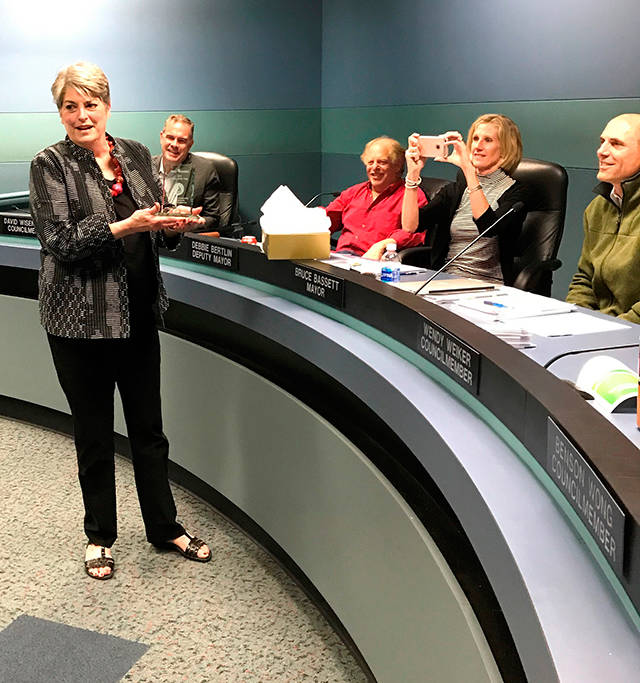 Former Chamber of Commerce director Terry Moreman accepts the Mercer Island “Citizen of the Year” award on June 5. Photo courtesy of Ross Freeman