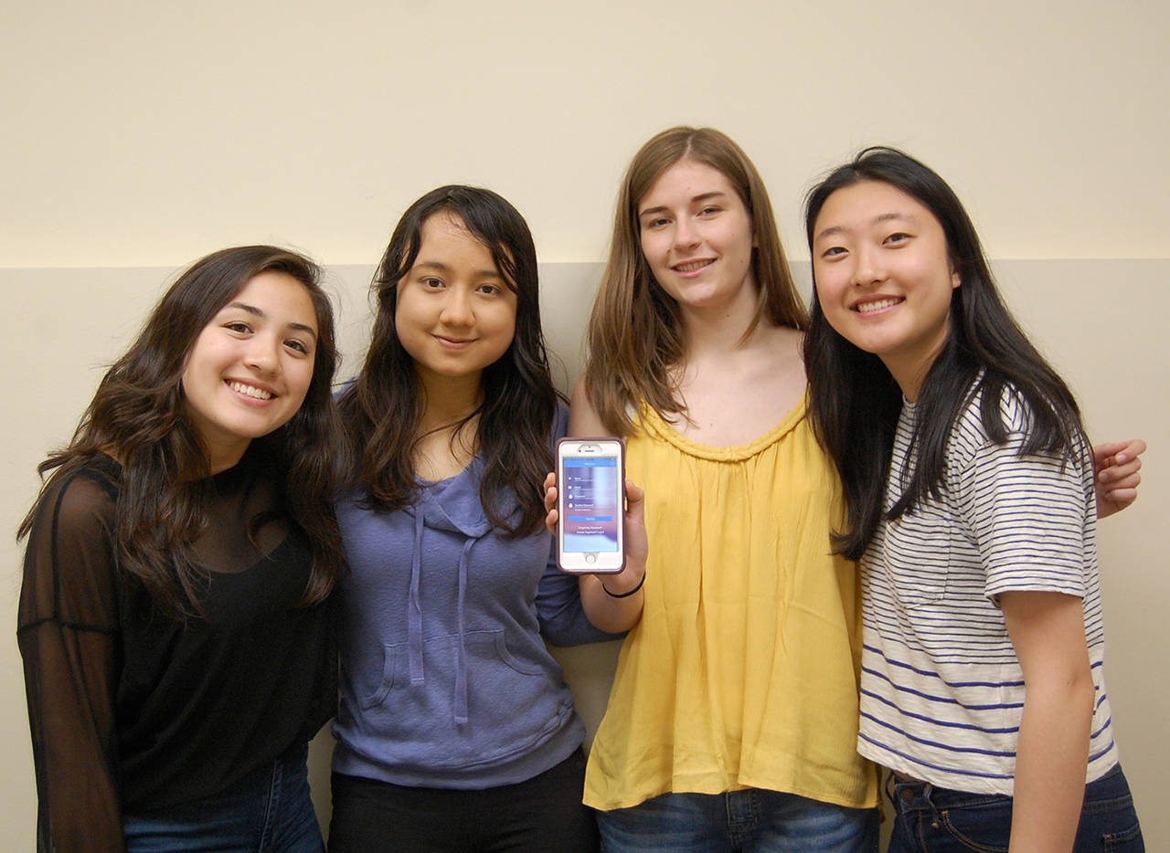 Valentina Muti, Zoe Sheill, Katherine Gelsey and Emily Kim show off the homescreen of their WeTutor app on June 9. Katie Metzger/staff photo